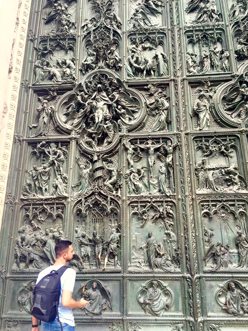 A close up of the bronze door, absolutely covered in intricate metalwork. 